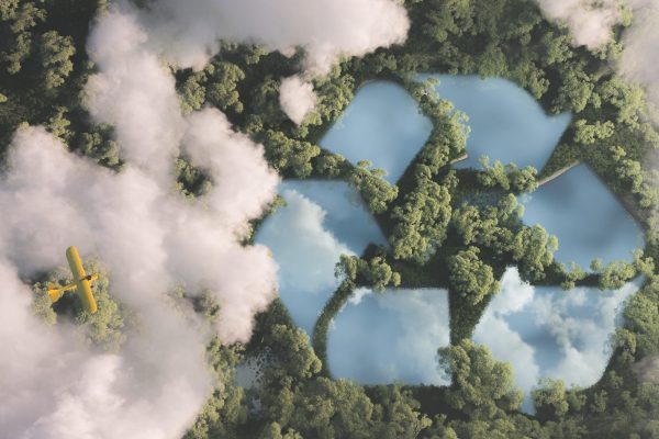 Eco friendly waste management concept. Recyclyling sign in a lake shape in the middle of dense amazonian rainforest vegetation viewed from high above clouds with small yellow airplane. 3d rendering. Circular Economy
