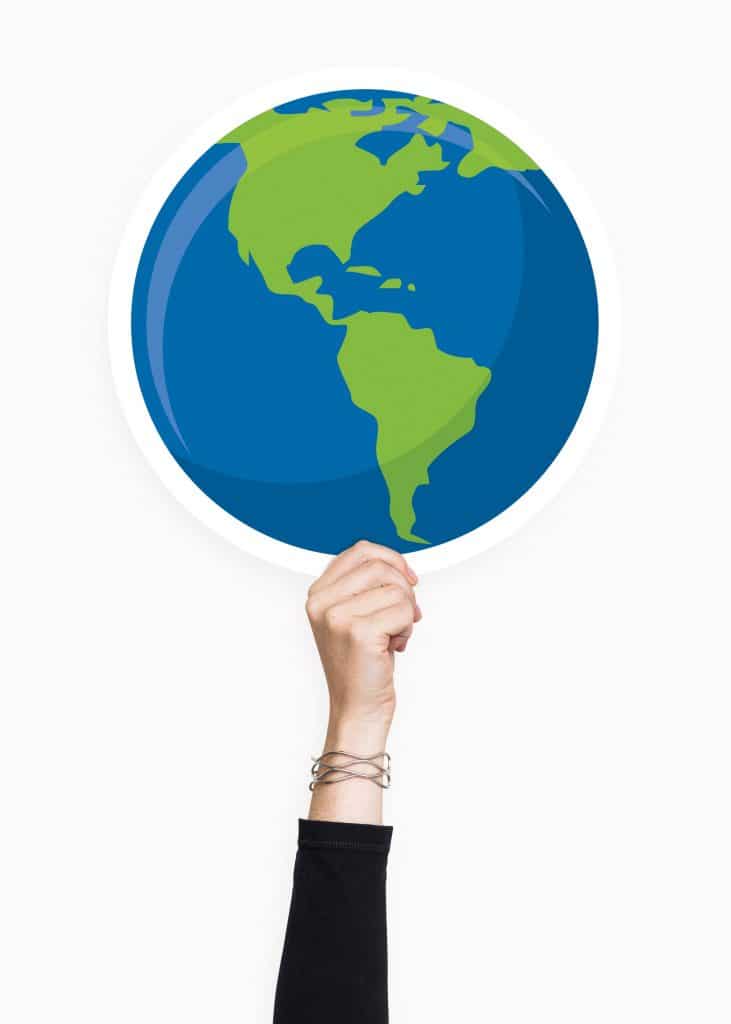 Hand hält Welt Eine Hand hält die Welt in die Höhe